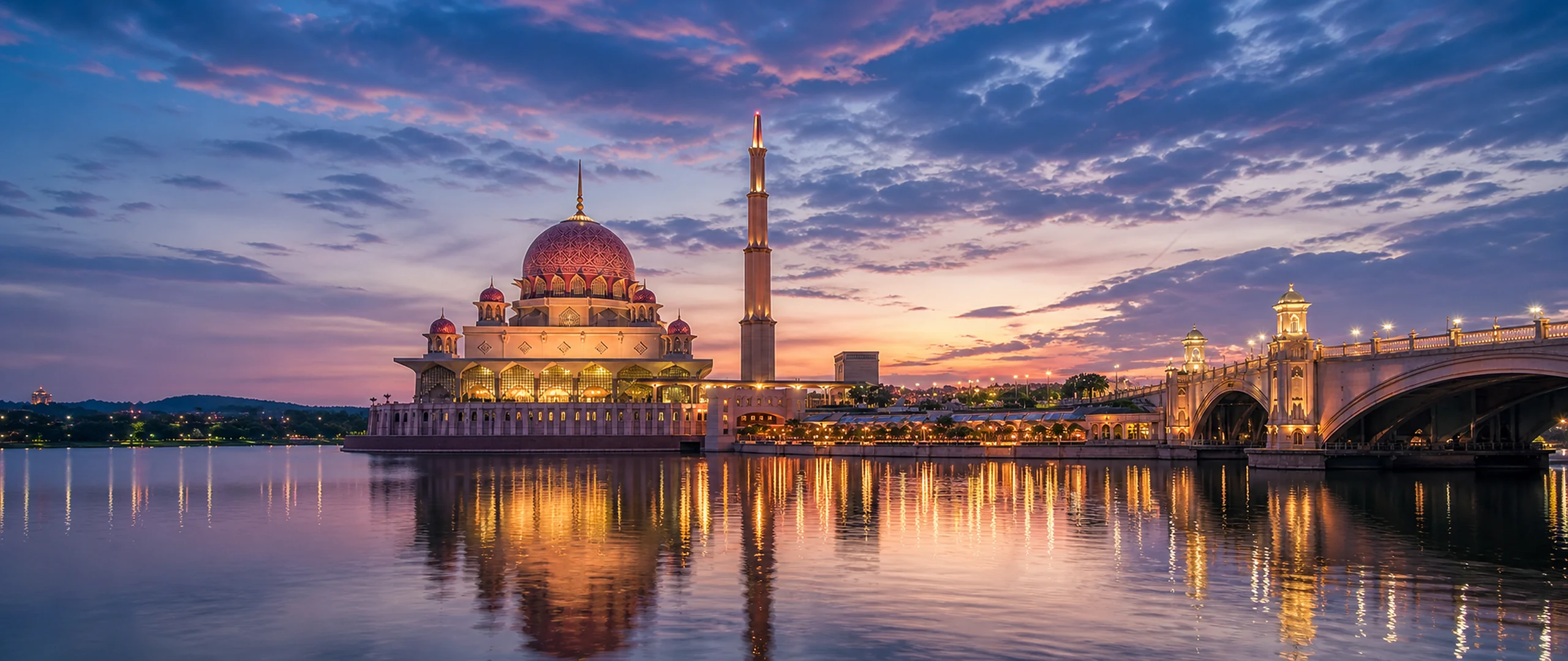 Putra Mosque and Putra Bridge reflected on Putrajaya Lake at dusk