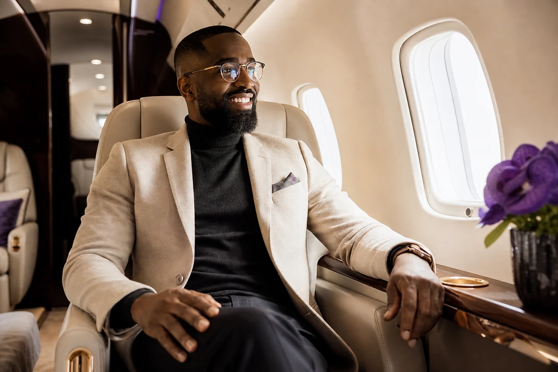 Stylish traveller relaxing in an elegant private jet cabin for a seamless ULux journey